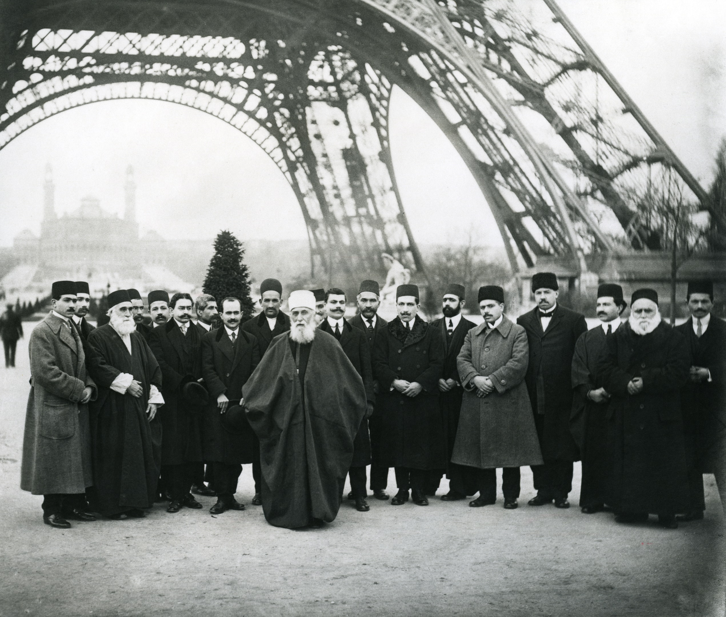 ‘Abdu’l-Bahá with a group of Bahá’ís under the Eiffel Tower in Paris, France, January 1913
